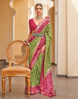 Collection of Green Patola Saree with Red Border in a gallery layout