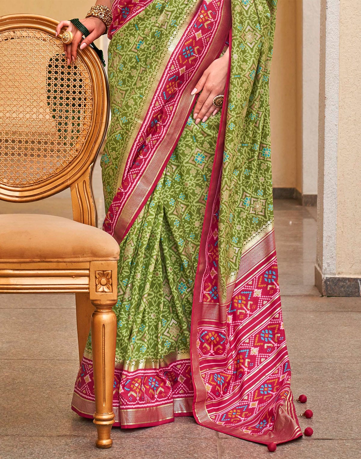 Collection of Green Patola Saree with Red Border in a gallery layout