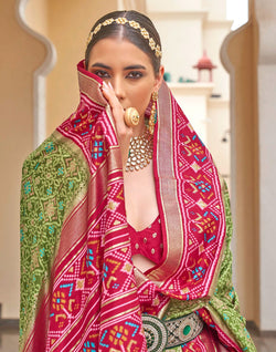 Collection of Green Patola Saree with Red Border in a gallery layout