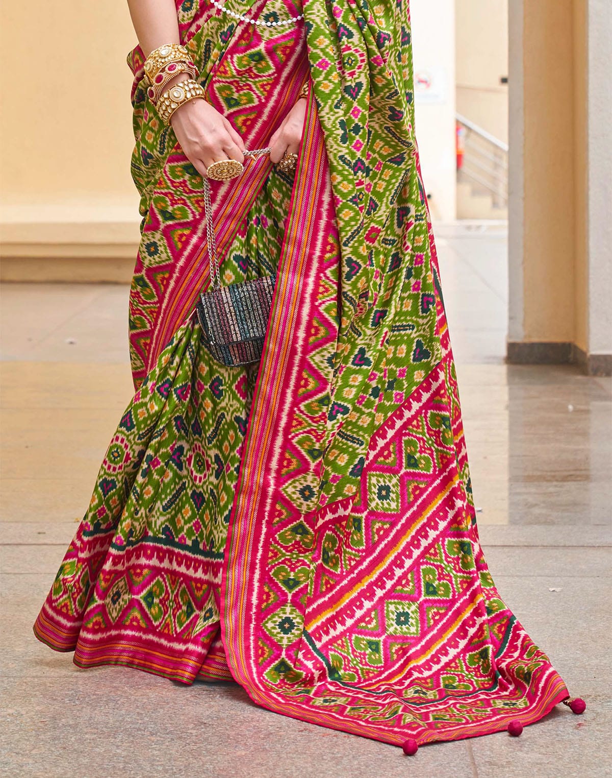 Collection of Green Ikat Print Patola Silk Saree in a gallery layout