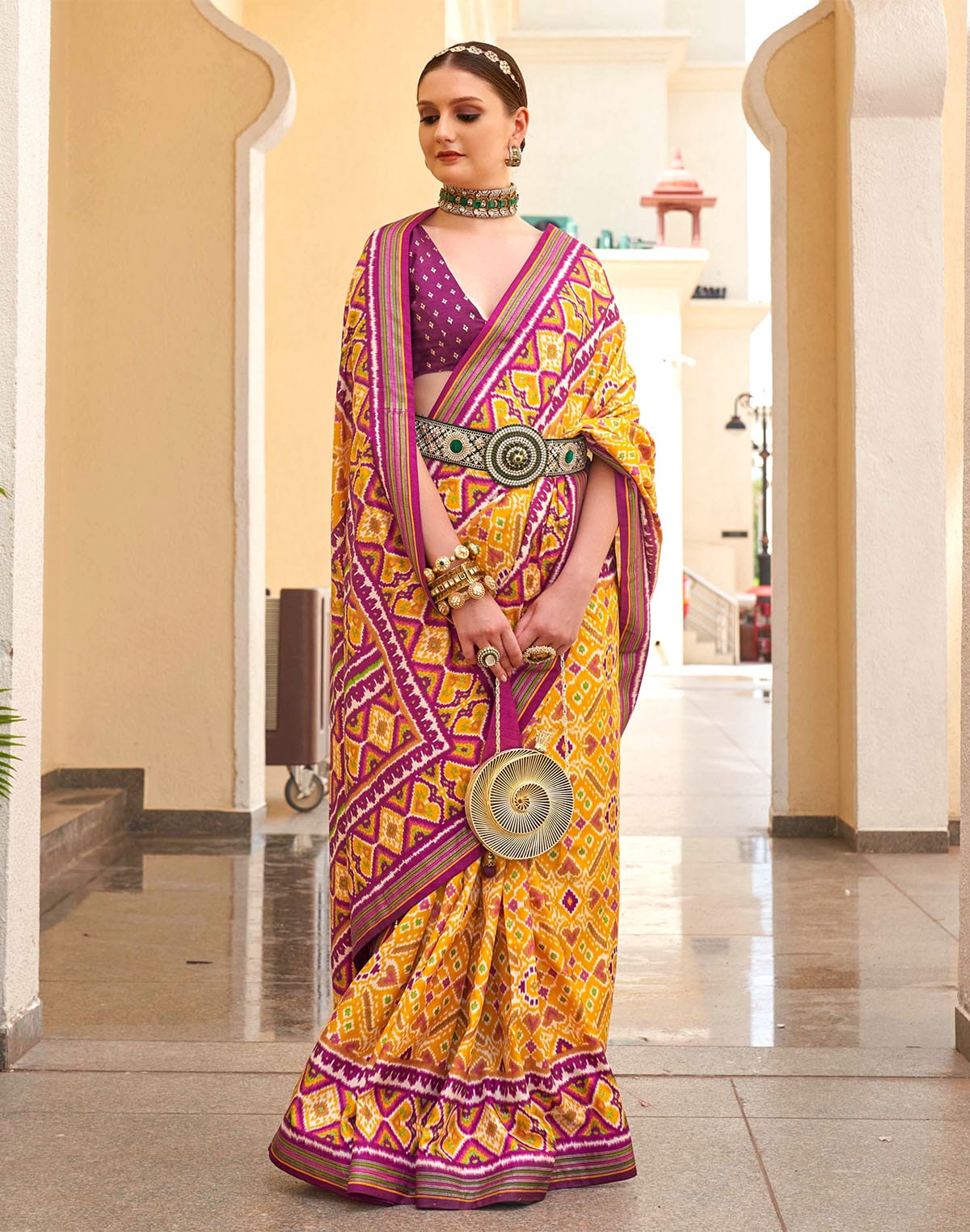 Collection of Mustard Patola Silk Festive Wear Saree in a gallery layout