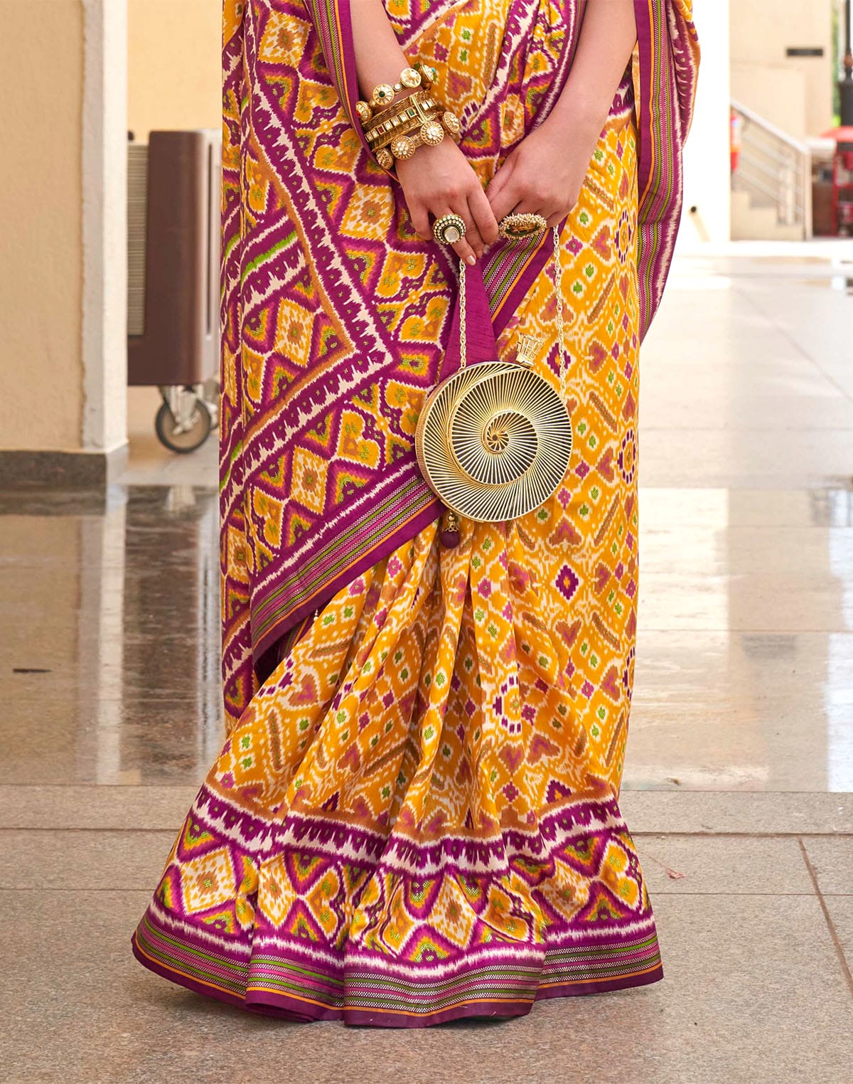 Collection of Mustard Patola Silk Festive Wear Saree in a gallery layout