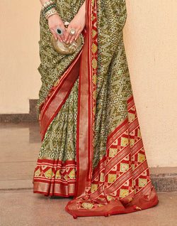 Collection of Mehendi Green all over Ikat Print Patola Designer Saree in a gallery layout