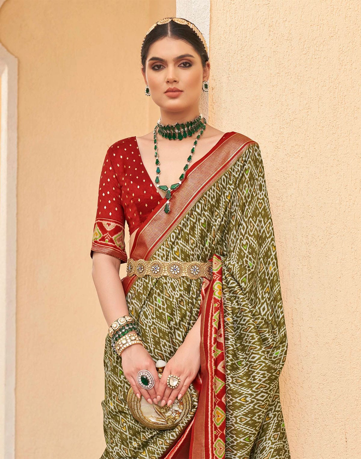 Collection of Mehendi Green all over Ikat Print Patola Designer Saree in a gallery layout