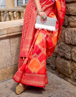 Collection of Orange Patola Silk Festive Wear Saree in a gallery layout