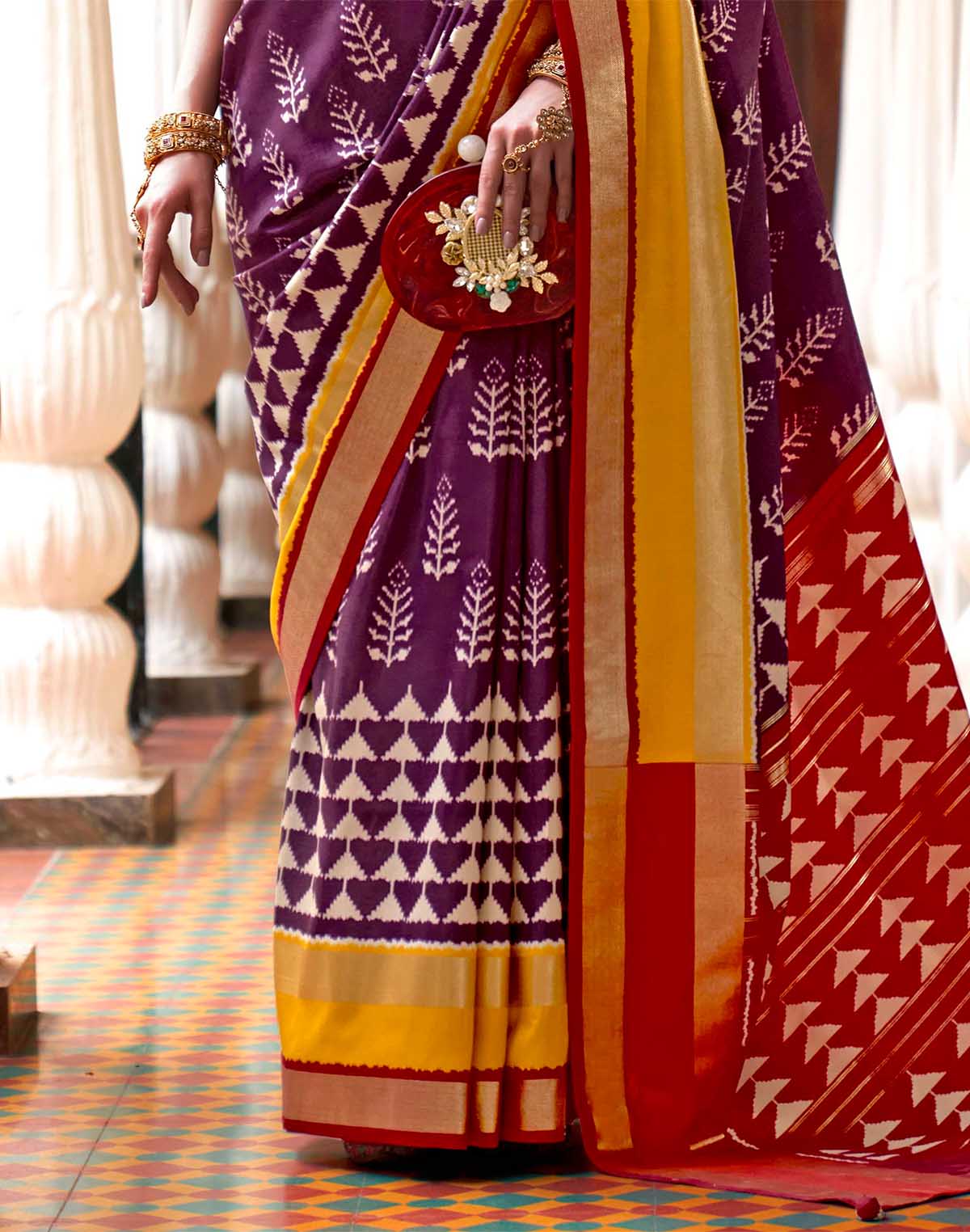 Collection of Purple Ikat Pattern Patola Silk Saree in a gallery layout