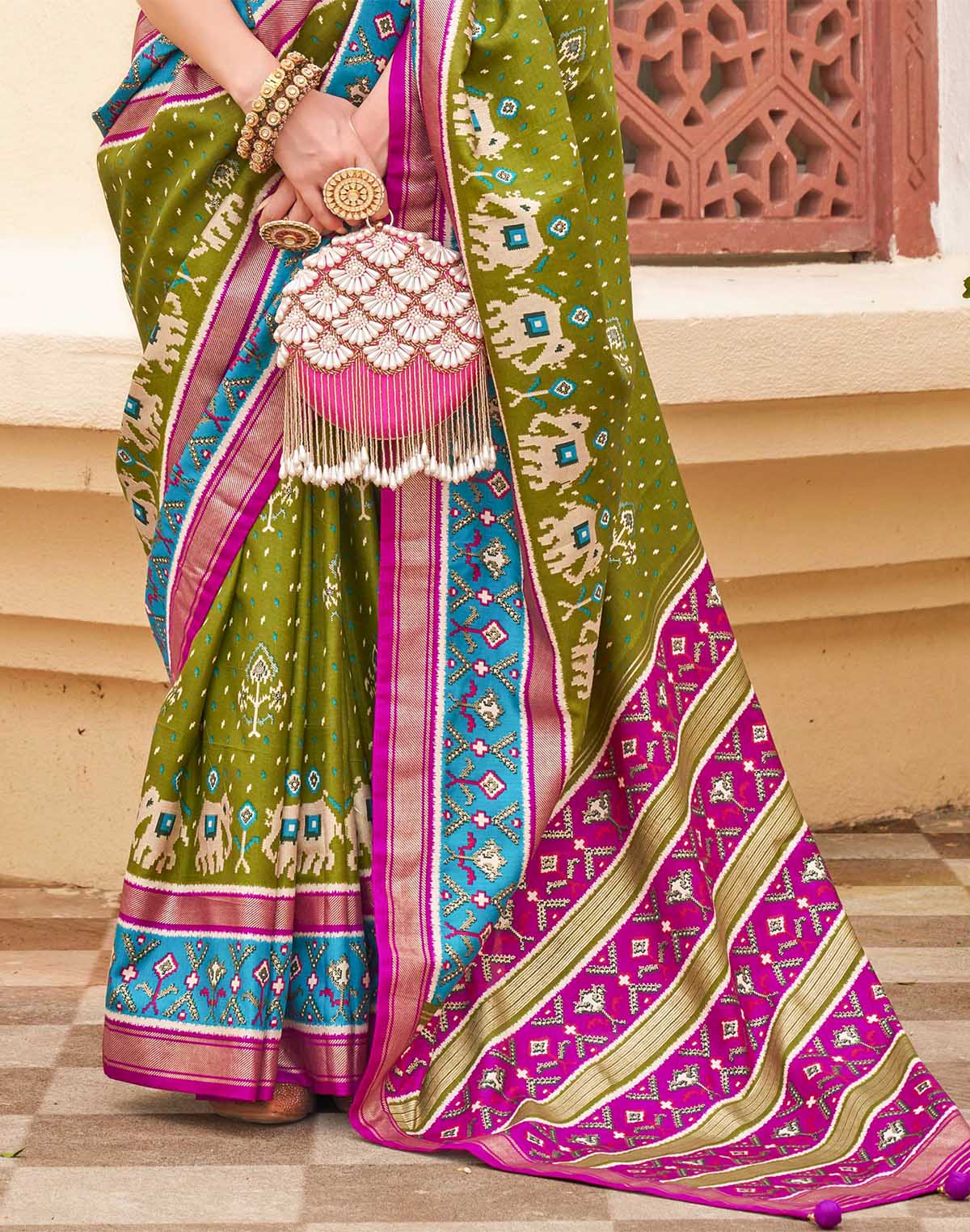 Collection of Elegant Patola Silk Green Saree in a gallery layout