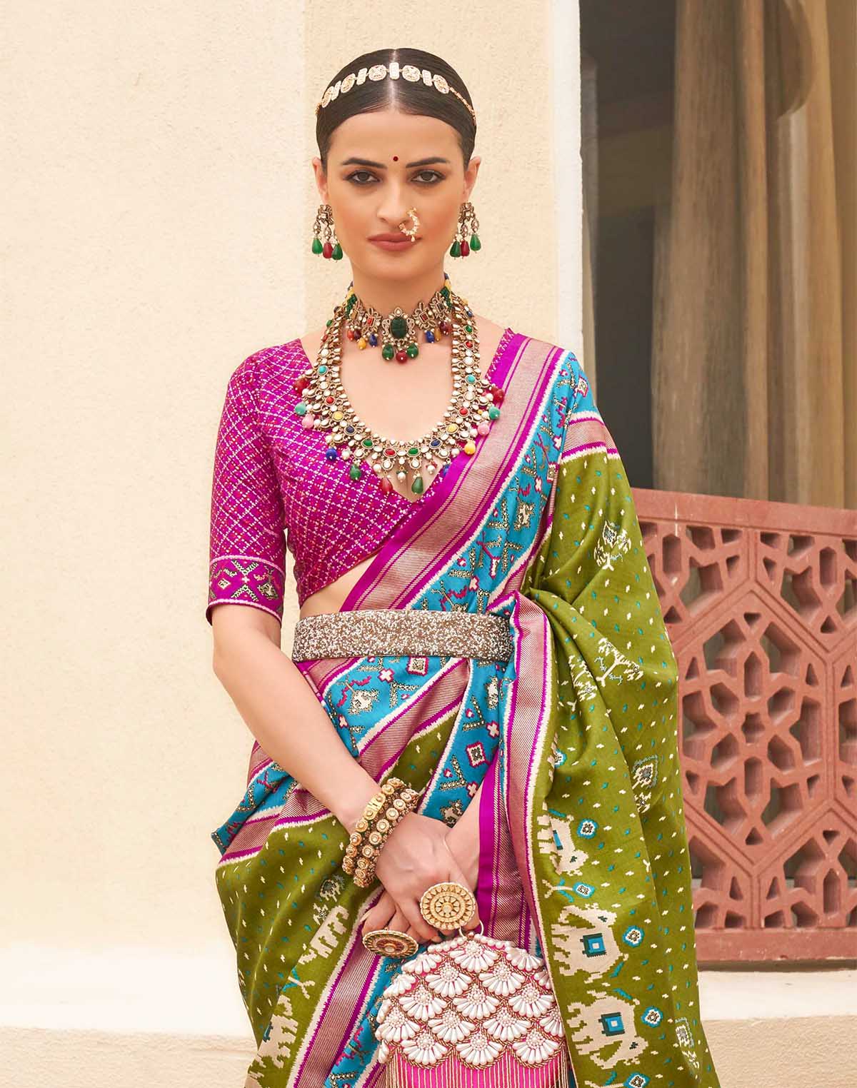 Collection of Elegant Patola Silk Green Saree in a gallery layout