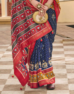 Collection of Navy Blue Palkhi Patola Contrast Border Saree in a gallery layout