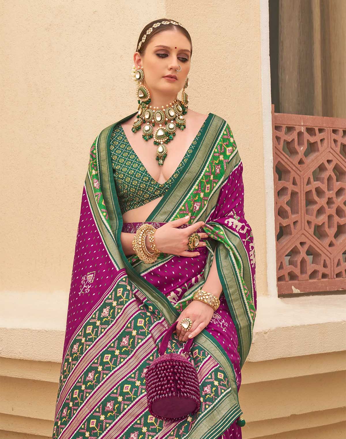 Collection of Wine Colour Patola Saree in a gallery layout