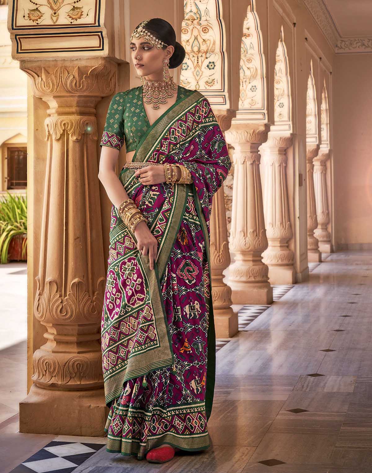 Collection of Stylish Wine Ikat Patola Designer Silk Saree in a gallery layout