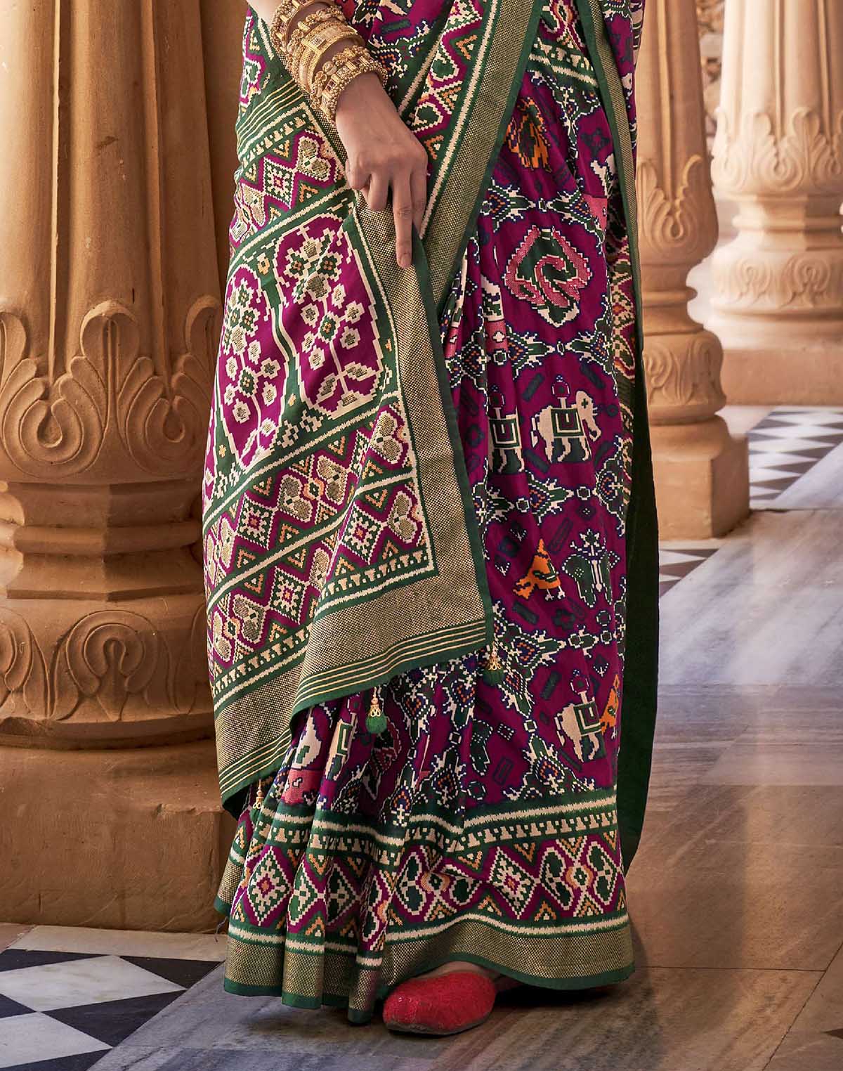 Collection of Stylish Wine Ikat Patola Designer Silk Saree in a gallery layout