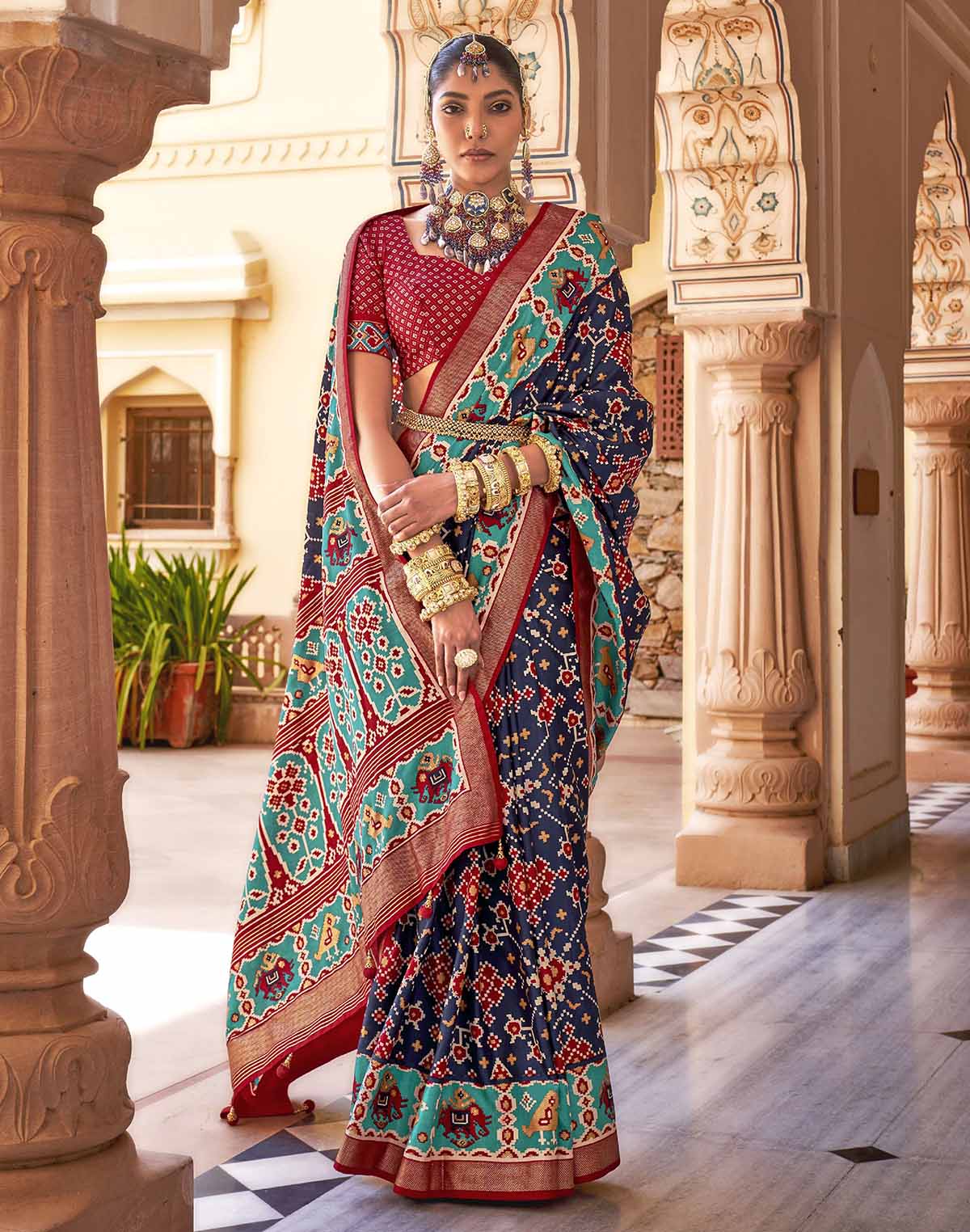 Collection of Navy Blue Ikat smooth Patola Fabric Saree in a gallery layout