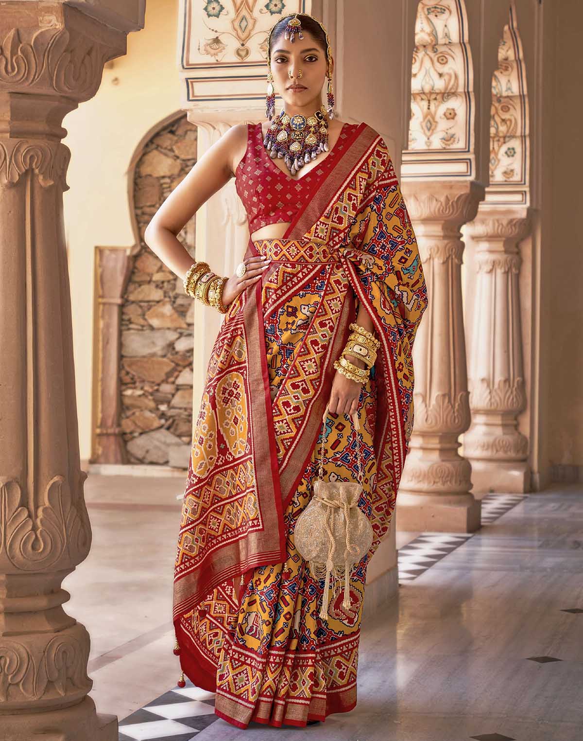 Collection of Mustard Ikat smooth Patola Fancy Saree in a gallery layout