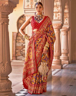 Collection of Mustard Ikat smooth Patola Fancy Saree in a gallery layout