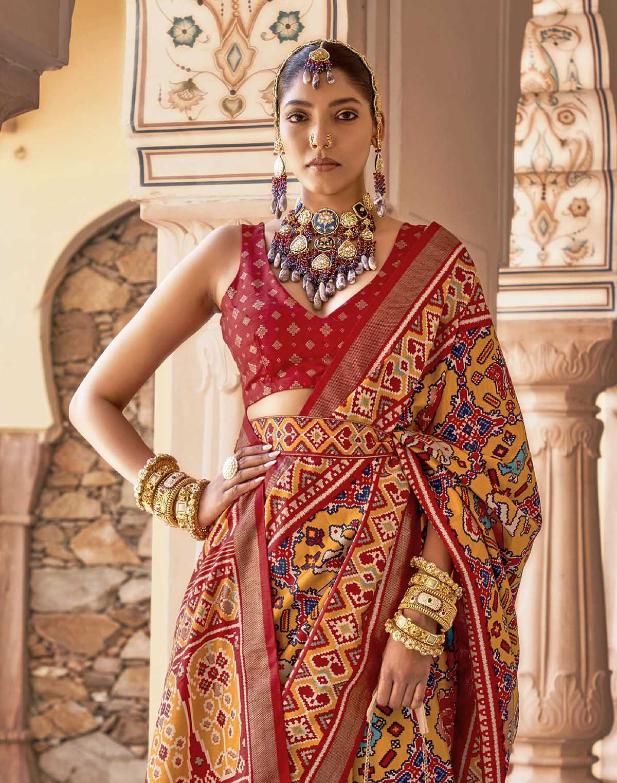 Collection of Mustard Ikat smooth Patola Fancy Saree in a gallery layout