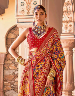 Collection of Mustard Ikat smooth Patola Fancy Saree in a gallery layout