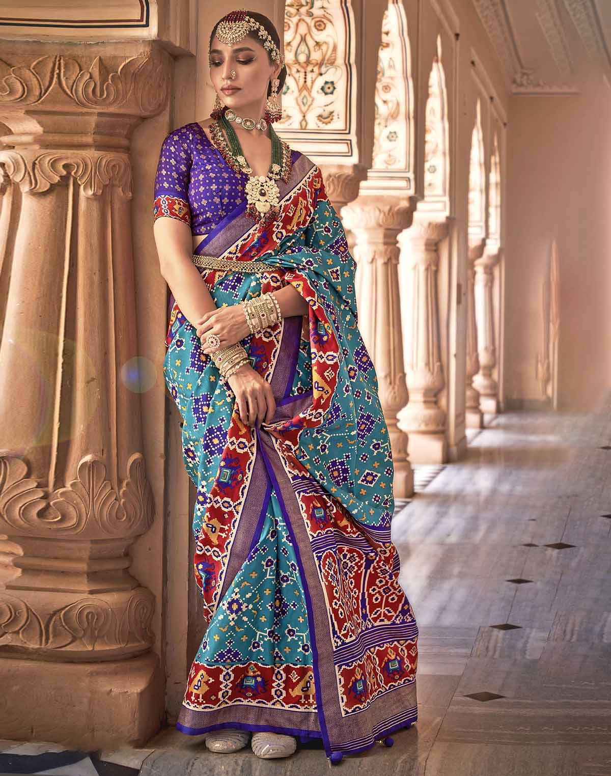 Collection of Sky Blue Printed Patola Silk Saree in a gallery layout