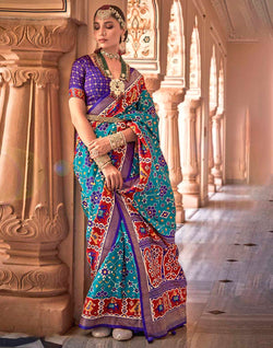 Collection of Sky Blue Printed Patola Silk Saree in a gallery layout