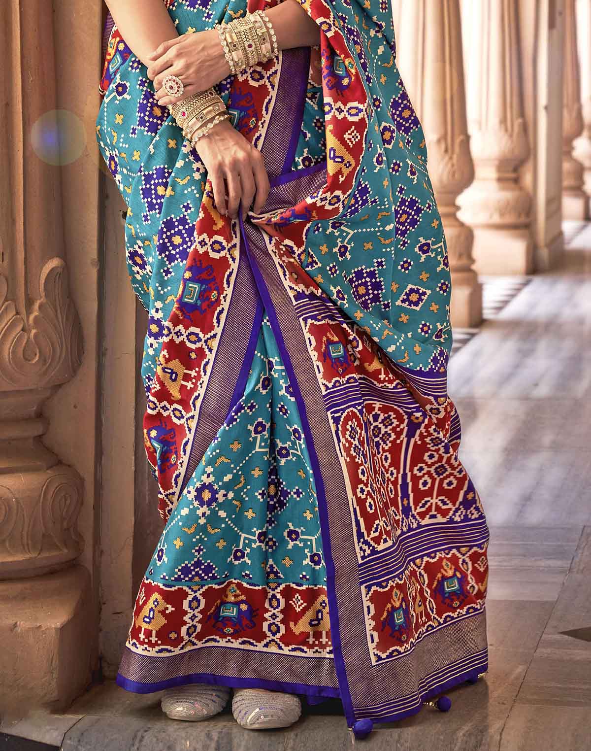 Collection of Sky Blue Printed Patola Silk Saree in a gallery layout