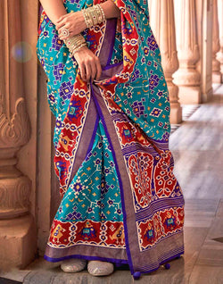 Collection of Sky Blue Printed Patola Silk Saree in a gallery layout