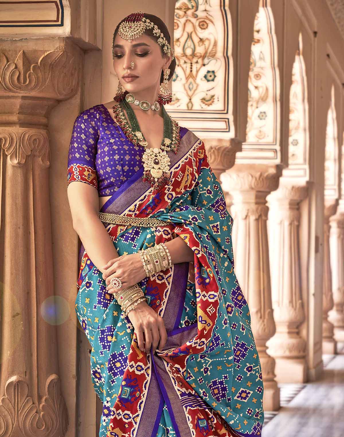 Collection of Sky Blue Printed Patola Silk Saree in a gallery layout