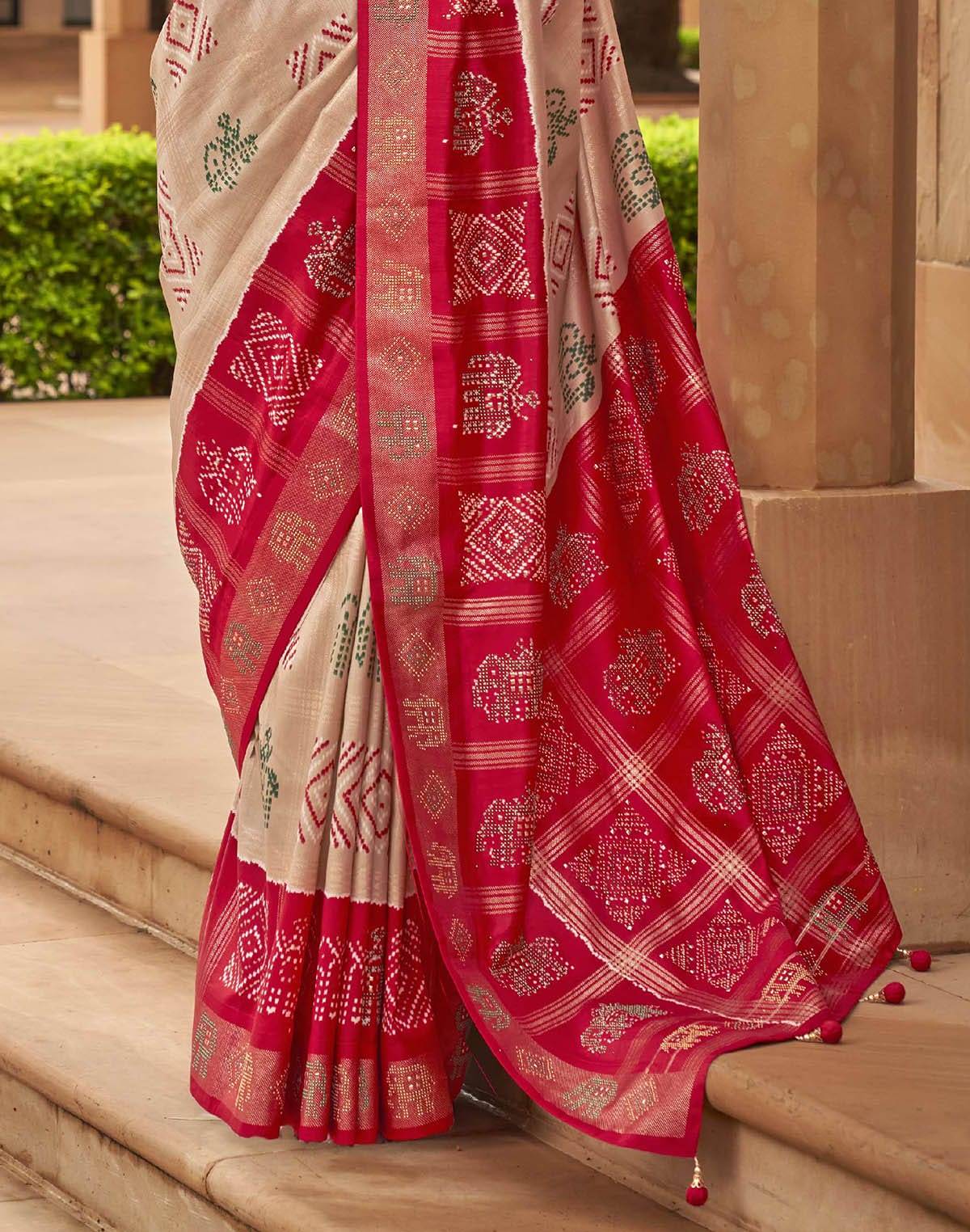 Collection of Cream Coloured Patola Silk Mirror work Saree in a gallery layout