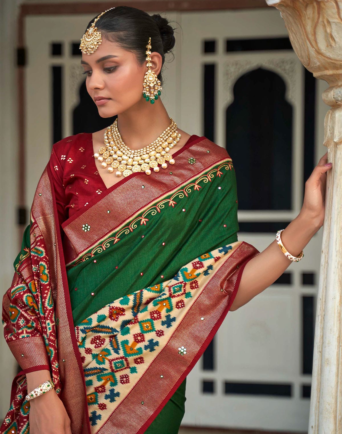 Collection of Dark Green Mirror work Patola Silk Designer Saree in a gallery layout