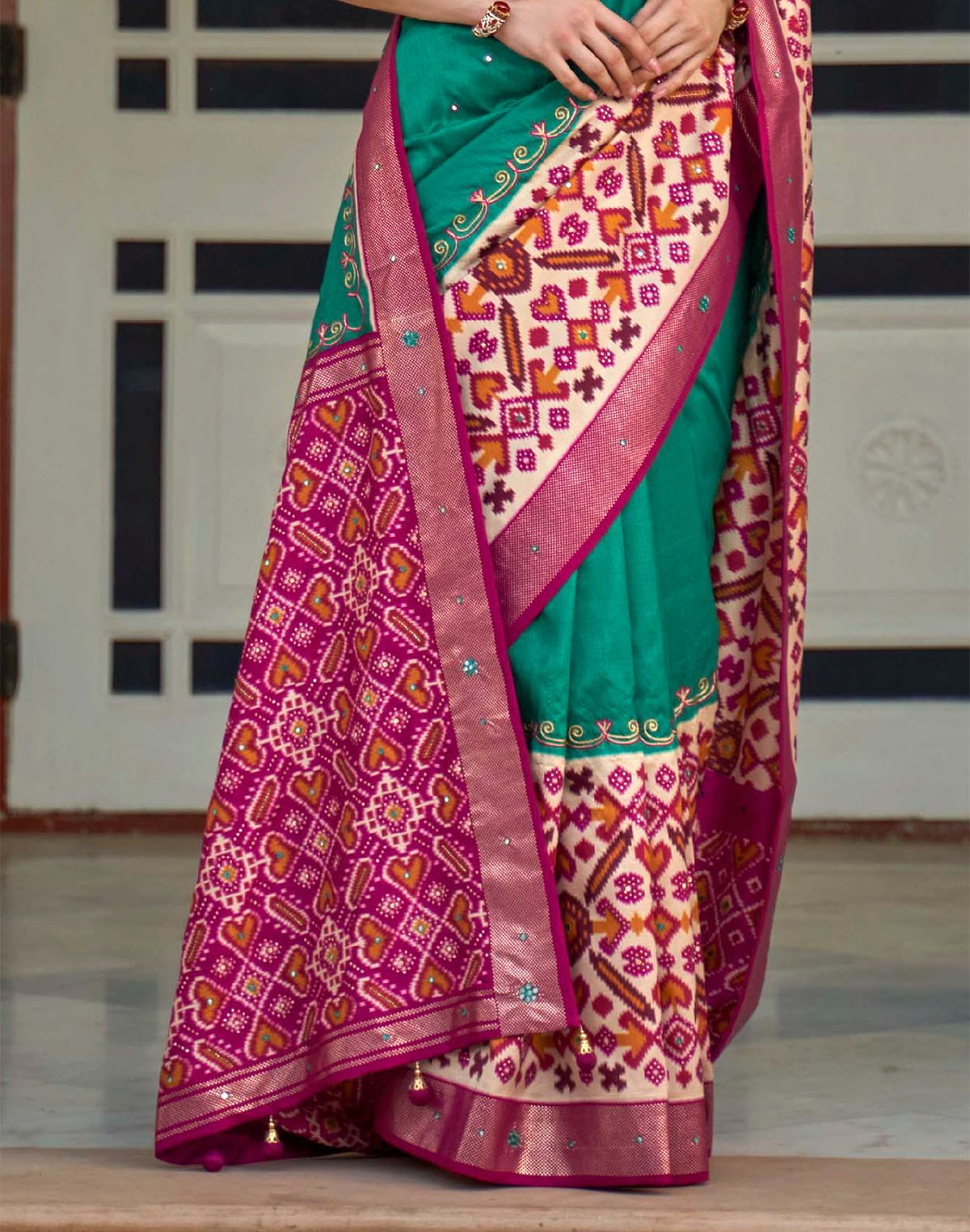 Collection of Sea Green Patola Silk Mirror work Saree in a gallery layout