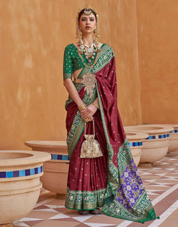 Collection of Maroon Coloured Patola Saree in a gallery layout