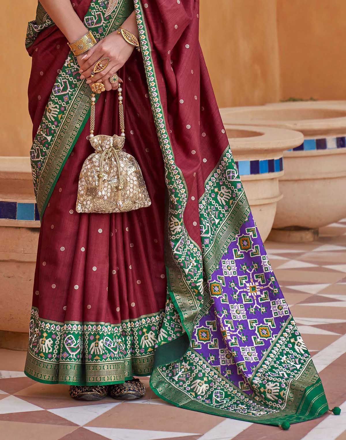 Collection of Maroon Coloured Patola Saree in a gallery layout