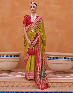 Collection of Ideal Patola Silk Mehendi Green Colour Saree in a gallery layout