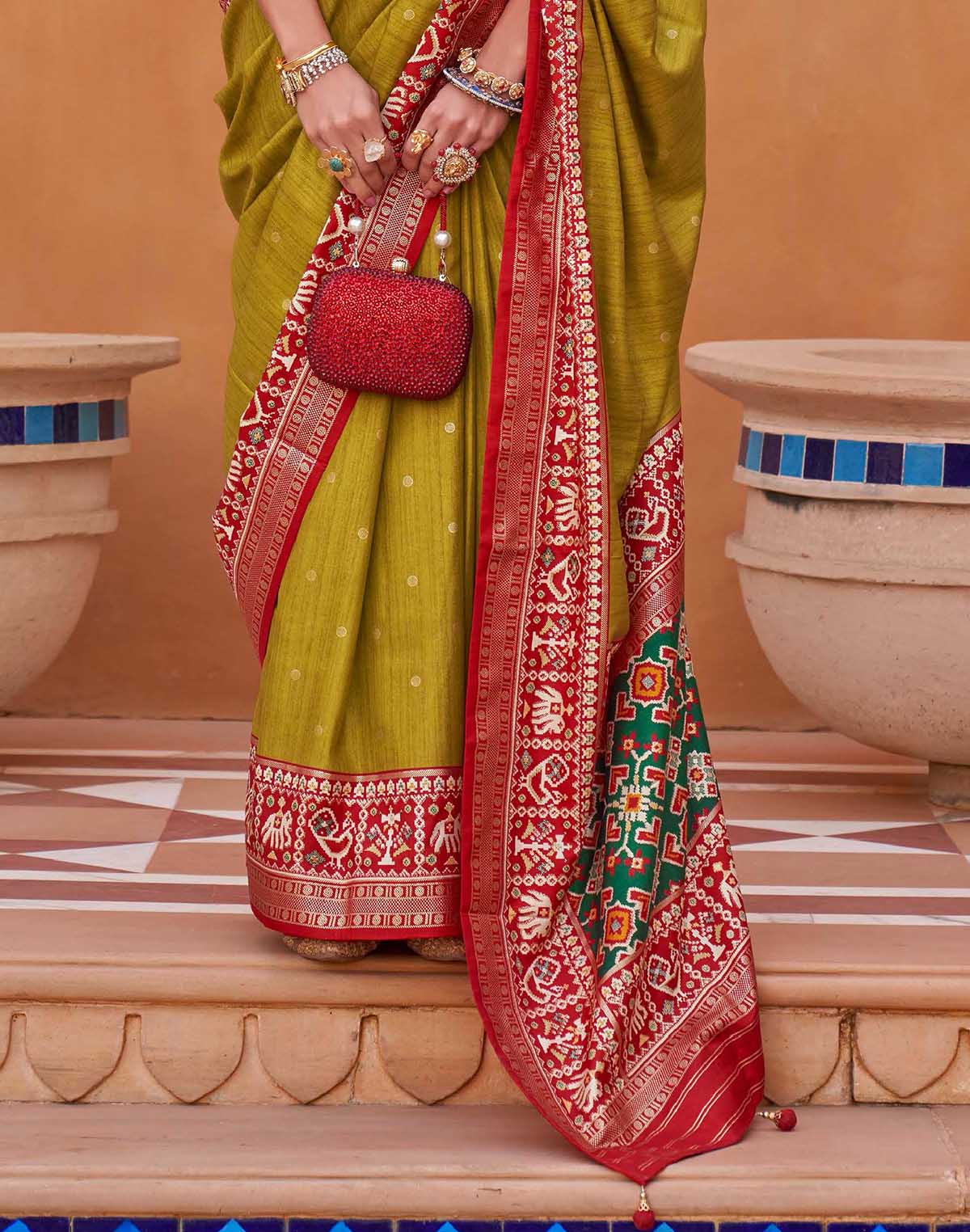 Collection of Ideal Patola Silk Mehendi Green Colour Saree in a gallery layout