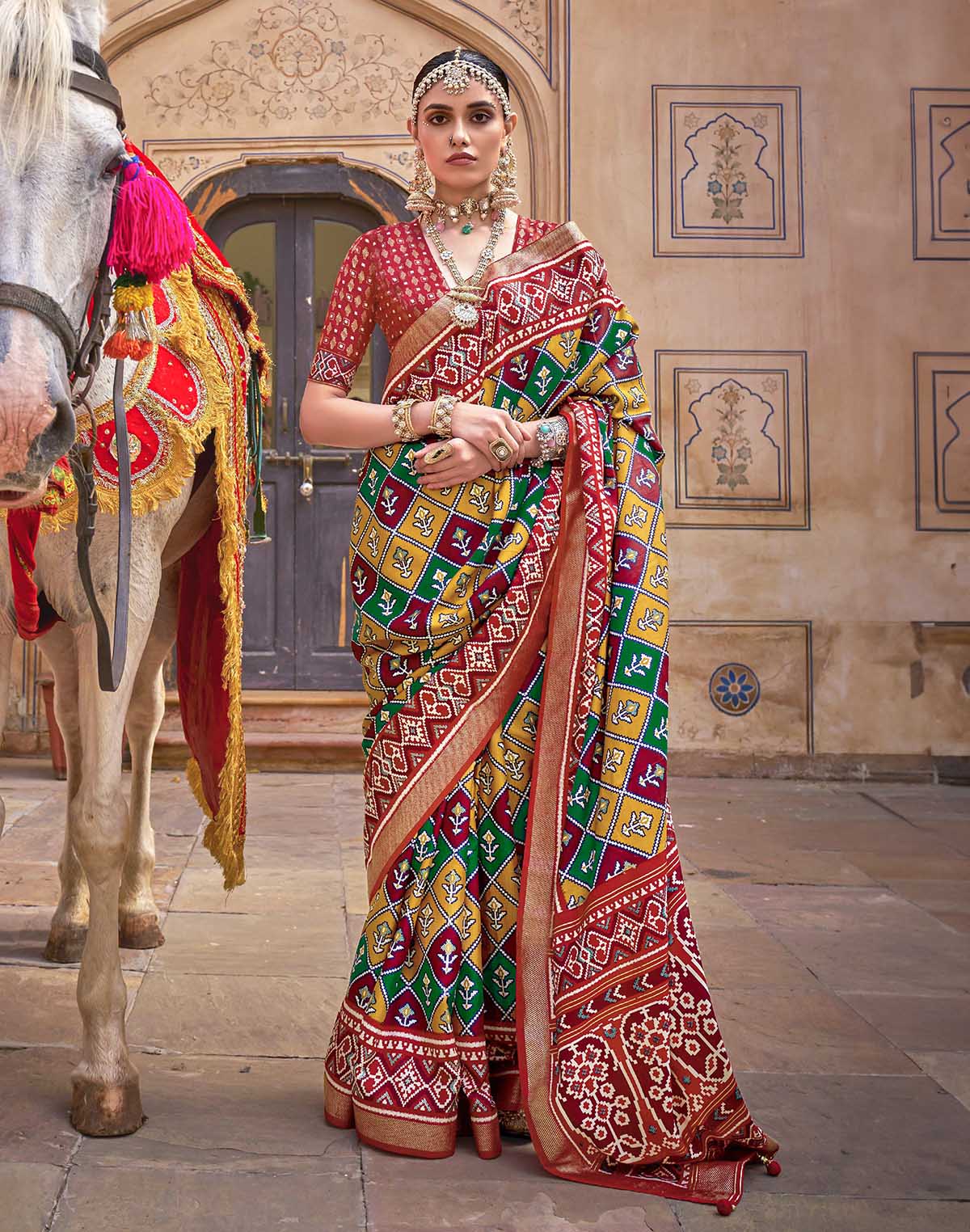 Collection of Mustard Ikat Print Patola Silk Saree in a gallery layout