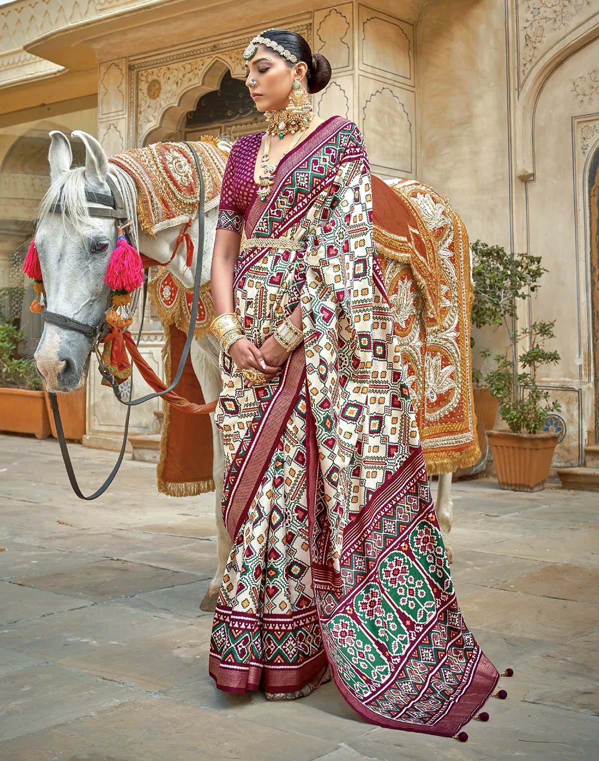 Collection of Cream all over Ikat Pattern Trendy Patola Silk Saree in a gallery layout