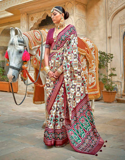 Collection of Cream all over Ikat Pattern Trendy Patola Silk Saree in a gallery layout