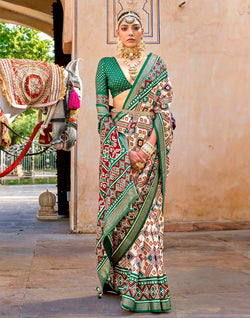 Collection of Green Ikat Patola Silk Saree with Unstitched Blouse in a gallery layout