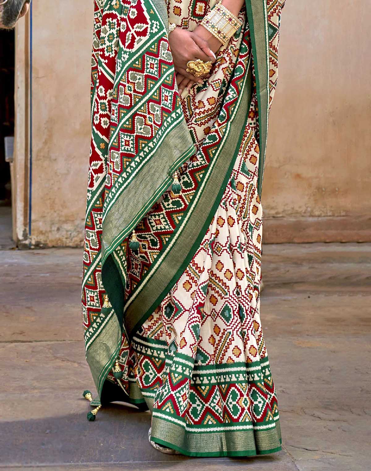 Collection of Green Ikat Patola Silk Saree with Unstitched Blouse in a gallery layout