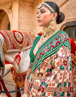 Collection of Green Ikat Patola Silk Saree with Unstitched Blouse in a gallery layout