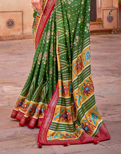 Collection of Dark Green smooth fabric Patola Saree in a gallery layout