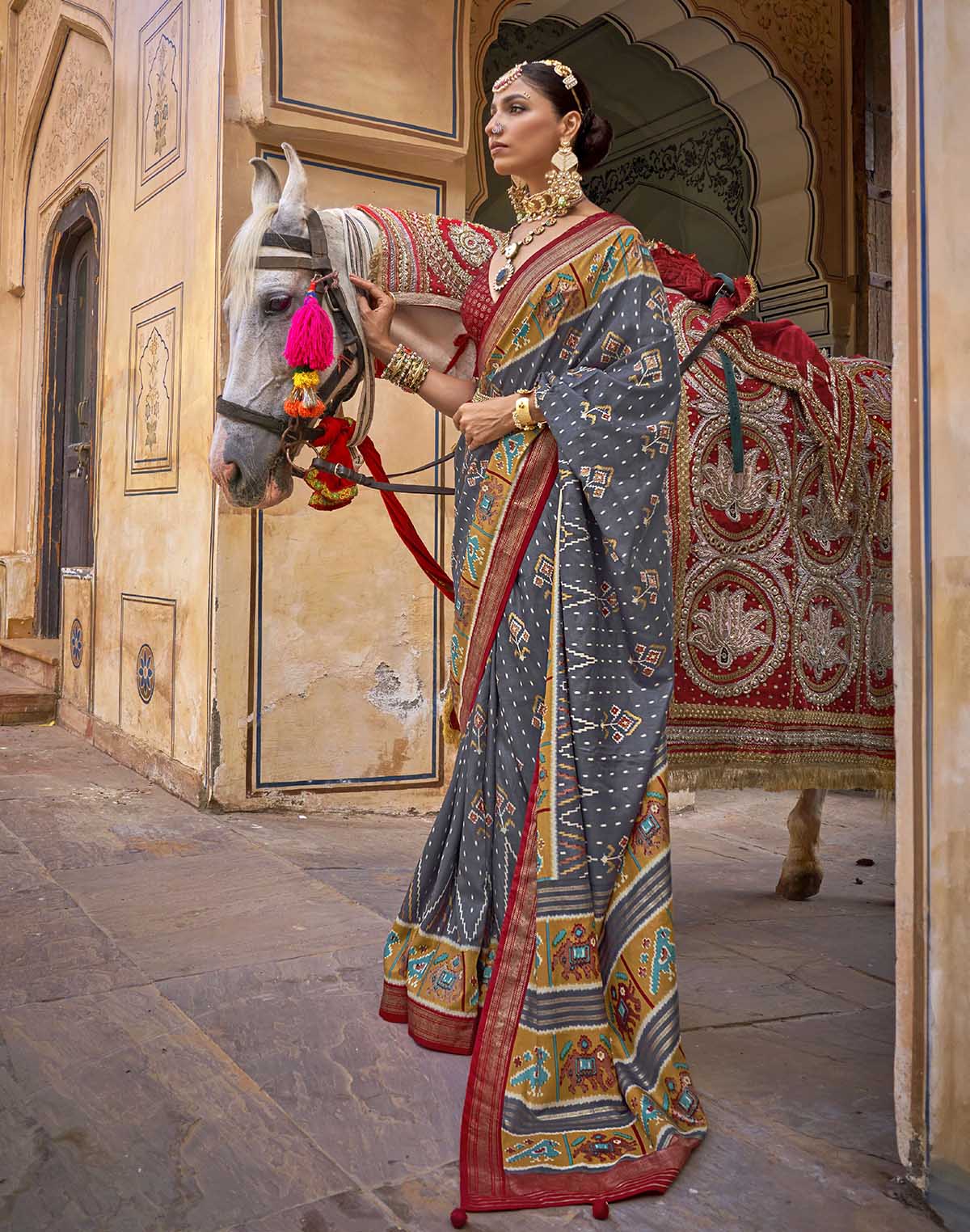 Collection of Iron Grey Ikat Patola Silk Saree in a gallery layout