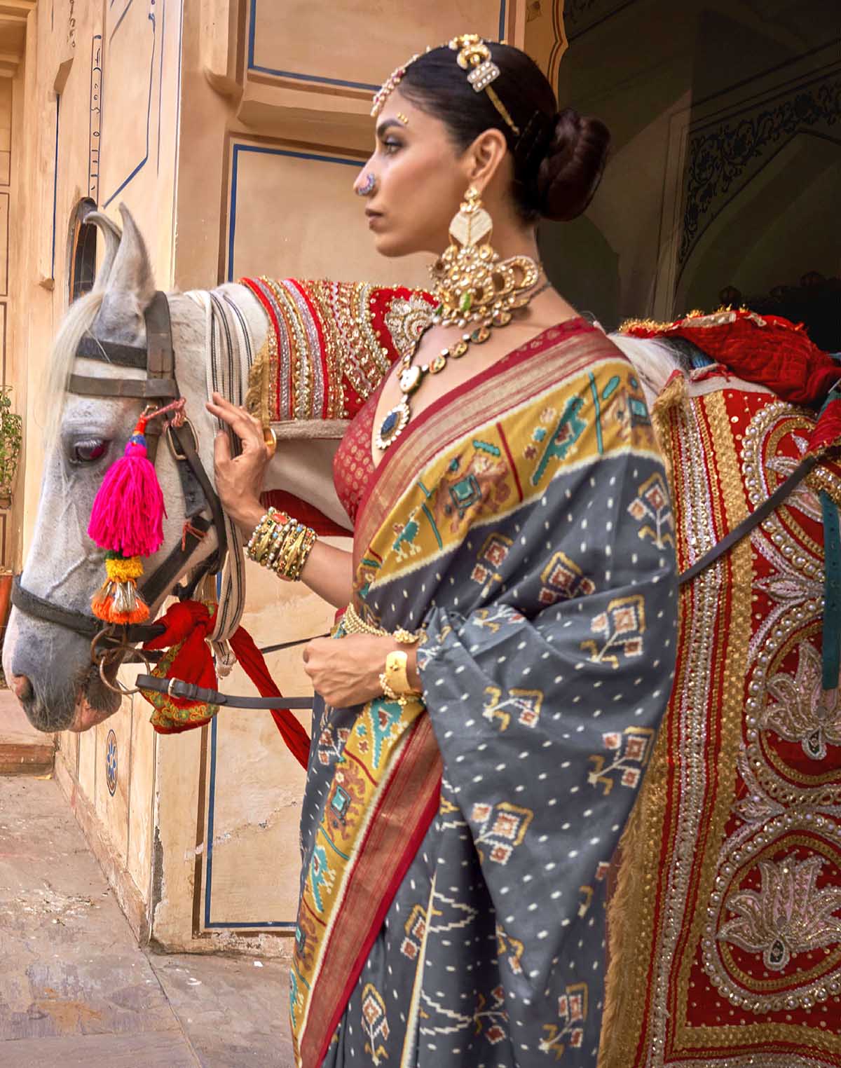 Collection of Iron Grey Ikat Patola Silk Saree in a gallery layout