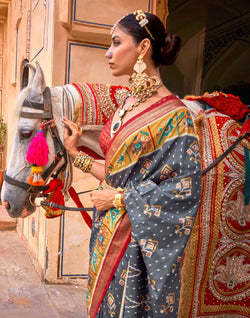 Collection of Iron Grey Ikat Patola Silk Saree in a gallery layout