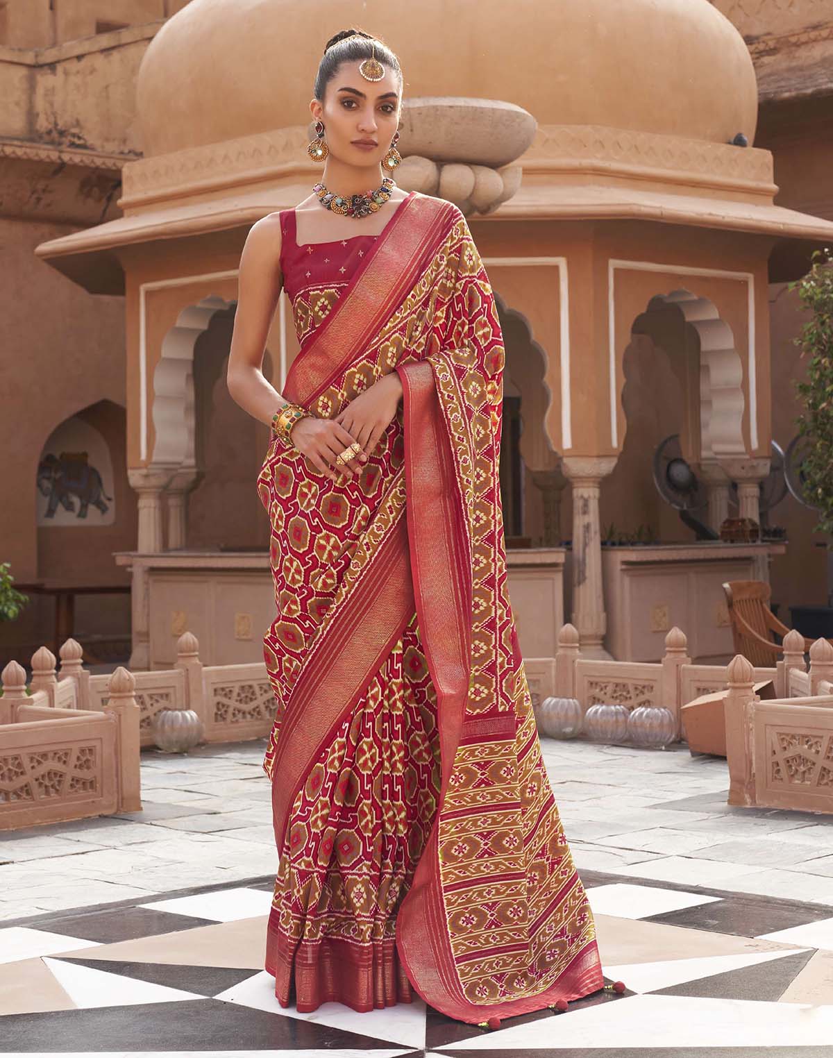 Collection of Red Pochampally Silk Patola Fancy Saree in a gallery layout