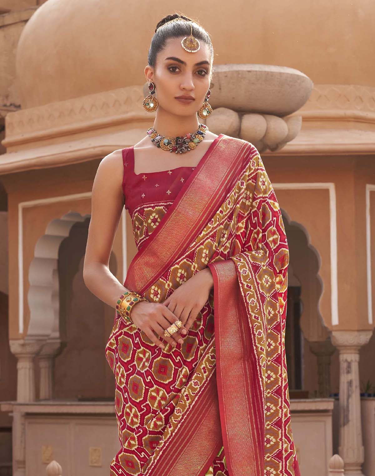 Collection of Red Pochampally Silk Patola Fancy Saree in a gallery layout