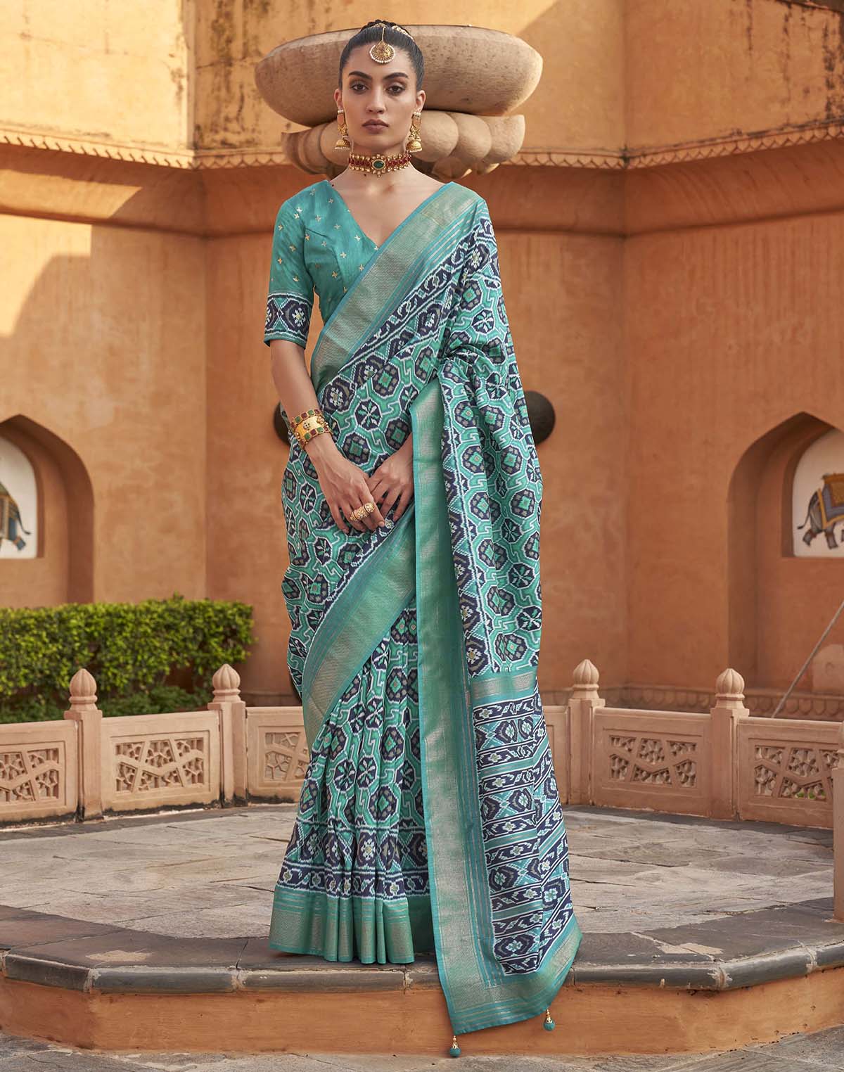 Collection of Light Green Ikat Patola Silk Saree in a gallery layout