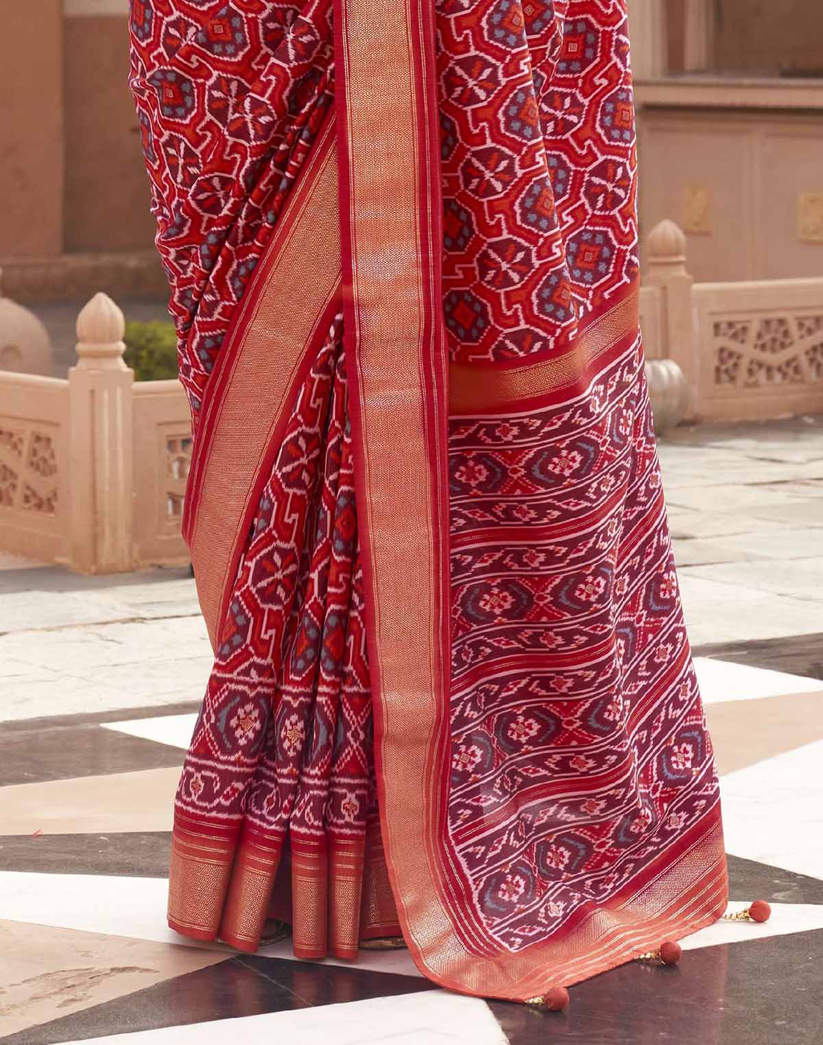 Collection of Red Ikat Print Patola Saree with Contrast Zari Border in a gallery layout