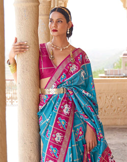 Collection of Sky Blue Designer Patola Silk Saree in a gallery layout