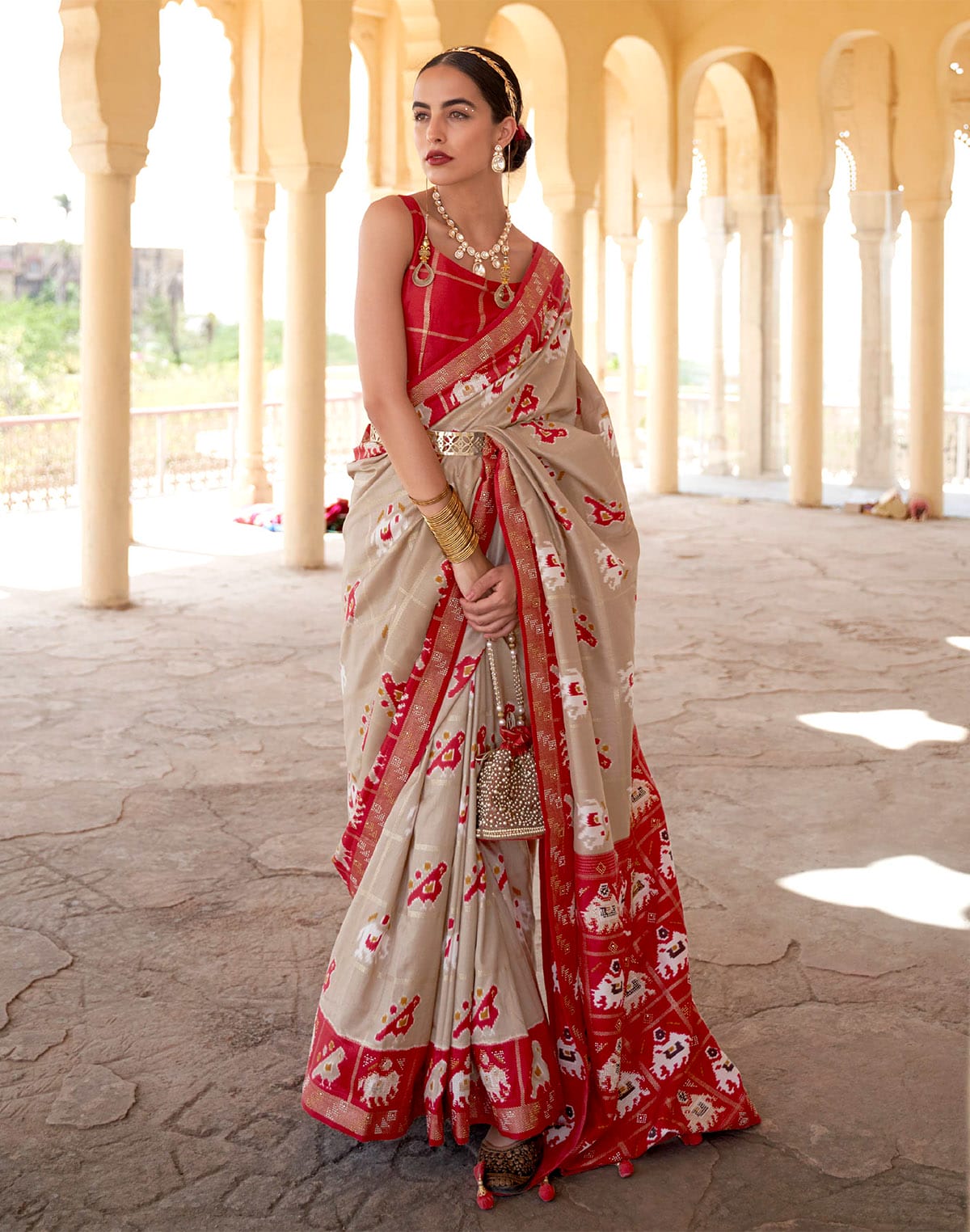 Collection of Elegant Beige Woven Design Patola Saree in a gallery layout