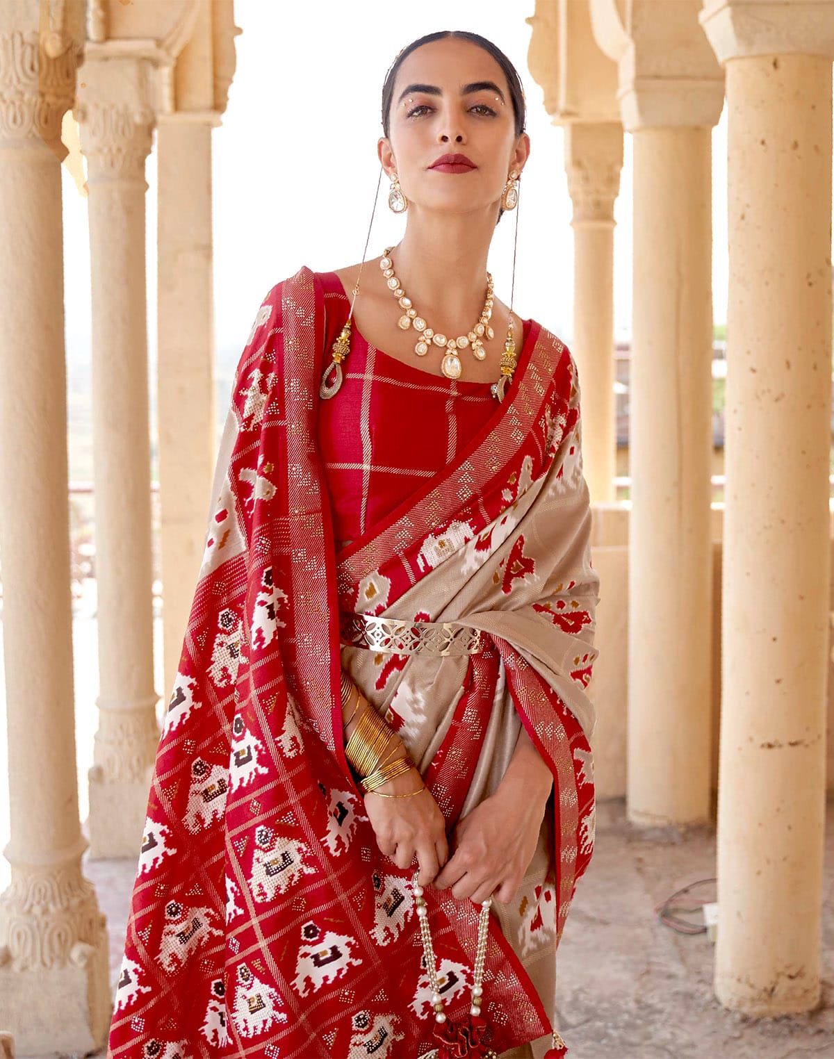 Collection of Elegant Beige Woven Design Patola Saree in a gallery layout